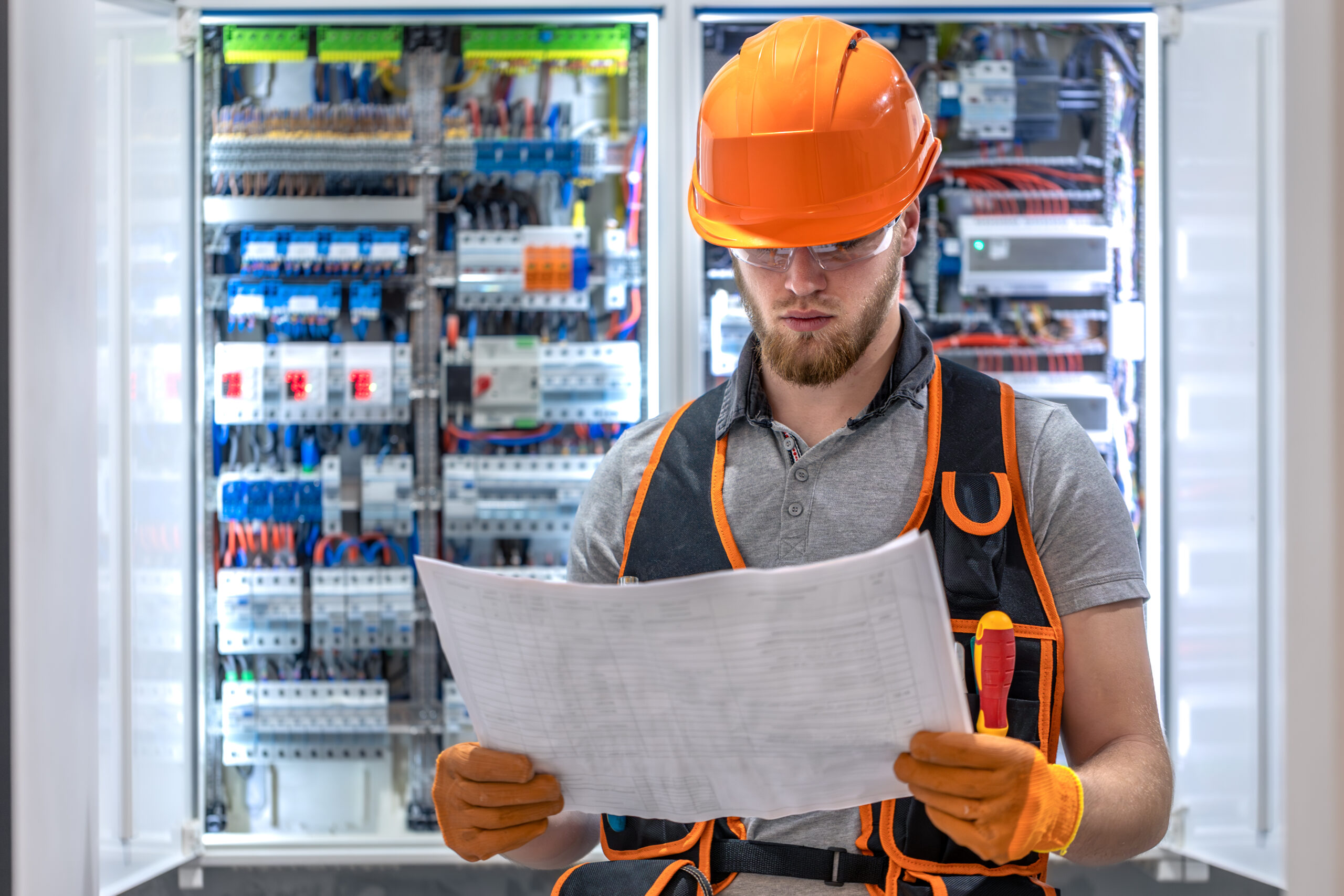 Male construction worker in overalls. Male electrician in overalls. Male construction worker in overalls. Male electrician in overalls.